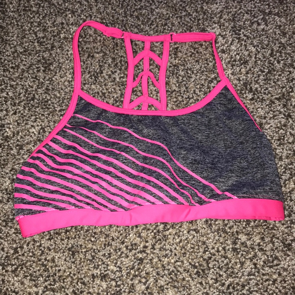 Gray sports bra with pink stripes and straps